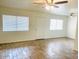 Spacious living area with tile floors and dual ceiling fans at 1702 W Tuckey Ln # 122, Phoenix, AZ 85015