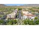 Aerial view of a shopping center with palm trees and mountains in the background at 19950 W Heatherbrae Dr, Litchfield Park, AZ 85340