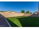 Artificial turf lawn and block wall at 19950 W Heatherbrae Dr, Litchfield Park, AZ 85340