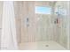 Large walk-in shower with tiled walls at 19950 W Heatherbrae Dr, Litchfield Park, AZ 85340