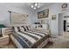 Well-lit bedroom with a queen-size bed and built-in closet at 215 N Power Rd # 361, Mesa, AZ 85205