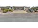 Beige manufactured home with covered porch, landscaping, and driveway at 215 N Power Rd # 361, Mesa, AZ 85205