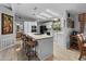 Open kitchen with island, granite countertops, and breakfast bar at 215 N Power Rd # 361, Mesa, AZ 85205