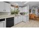 Bright kitchen with white cabinets, tile floors, and modern appliances at 215 N Power Rd # 361, Mesa, AZ 85205