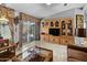 Bright living room with large windows and wood entertainment center at 215 N Power Rd # 361, Mesa, AZ 85205