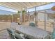 Covered patio with table and chairs, perfect for outdoor dining at 215 N Power Rd # 361, Mesa, AZ 85205