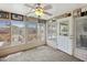 Sunroom with multiple windows, ceiling fan, and storage at 215 N Power Rd # 361, Mesa, AZ 85205