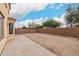 Empty backyard with plenty of space for customization, behind the house at 21869 W Mohave St, Buckeye, AZ 85326