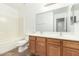 Bathroom with double sink vanity, toilet, and bathtub at 21869 W Mohave St, Buckeye, AZ 85326