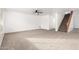 Open living room filled with natural light and a ceiling fan at 21869 W Mohave St, Buckeye, AZ 85326