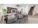 Living Room with stylish furnishings, built-in shelves, and a ceiling fan at 21869 W Mohave St, Buckeye, AZ 85326