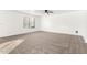 Spacious main bedroom with carpet, ceiling fan, and large window at 21869 W Mohave St, Buckeye, AZ 85326