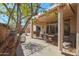 Covered patio with seating area and desert landscaping at 22405 N 148Th Ave, Sun City West, AZ 85375