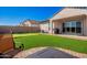 Backyard with putting green and patio furniture at 22635 N Rummler Ln, Maricopa, AZ 85138