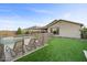 Landscaped backyard with pool, lounge chairs, and artificial turf at 22918 E Marsh Rd, Queen Creek, AZ 85142