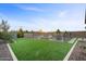 Expansive backyard with artificial turf and a sparkling pool at 22918 E Marsh Rd, Queen Creek, AZ 85142