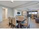 Open concept dining area with a view of the living room and entryway at 22918 E Marsh Rd, Queen Creek, AZ 85142