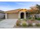 Single story home with a two car garage and landscaped front yard at 22918 E Marsh Rd, Queen Creek, AZ 85142