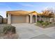 Single story home with a two car garage and landscaped front yard at 22918 E Marsh Rd, Queen Creek, AZ 85142
