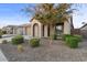 Single story home with a two car garage and landscaped front yard at 22918 E Marsh Rd, Queen Creek, AZ 85142