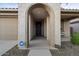Front porch with arched entryway and decorative door at 22918 E Marsh Rd, Queen Creek, AZ 85142