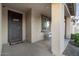Covered front porch with decorative door and seating at 22918 E Marsh Rd, Queen Creek, AZ 85142