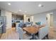 Kitchen features dark cabinetry, an island, and an eat-in area at 22918 E Marsh Rd, Queen Creek, AZ 85142