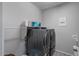 Laundry room with washer, dryer, and additional shelving at 22918 E Marsh Rd, Queen Creek, AZ 85142