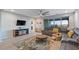 Relaxing living room featuring sectional sofa and access to backyard patio at 22918 E Marsh Rd, Queen Creek, AZ 85142