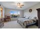 Large main bedroom with a king-size bed and a vanity at 22918 E Marsh Rd, Queen Creek, AZ 85142