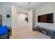 Home office with TV, double doors, and additional space at 22918 E Marsh Rd, Queen Creek, AZ 85142