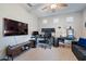 Spacious home office with large TV and work station at 22918 E Marsh Rd, Queen Creek, AZ 85142