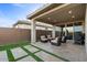 Relaxing covered patio area with seating and a grill at 22918 E Marsh Rd, Queen Creek, AZ 85142