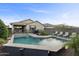 Luxury pool with patio, seating, and fire pit feature at 22918 E Marsh Rd, Queen Creek, AZ 85142