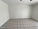 Simple bedroom with tile flooring and neutral wall colors at 3047 E Rosemonte Dr, Phoenix, AZ 85050