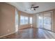 Bright dining room with tile floors and access to backyard at 42575 W Abbey Rd, Maricopa, AZ 85138