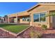 Home exterior with artificial turf and patio at 42575 W Abbey Rd, Maricopa, AZ 85138