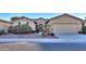 One-story house with a two-car garage and desert landscaping at 42575 W Abbey Rd, Maricopa, AZ 85138