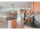 Kitchen with large island, granite countertops, and stainless steel appliances at 42575 W Abbey Rd, Maricopa, AZ 85138