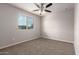 Cozy bedroom with carpeted floor and a window with blinds at 5438 W Odeum Ln, Phoenix, AZ 85043