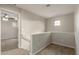 Upstairs hallway with carpet and access to bedrooms at 5438 W Odeum Ln, Phoenix, AZ 85043