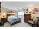 Cozy bedroom with a queen-size bed and a dresser at 649 S Power Rd # 371, Mesa, AZ 85206