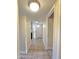 Bright hallway with tile floors and access to rooms at 7550 N 12Th St # 143, Phoenix, AZ 85020