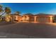 Charming two-story home with a three-car garage, paver driveway, and desert landscaping at 10325 W Bayside Rd, Sun City, AZ 85351