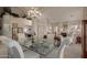 Bright dining area with a glass-top table and view into living room at 10929 E Spring Creek Rd, Sun Lakes, AZ 85248