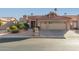 Tan two-car garage home with tile roof and desert landscaping at 10929 E Spring Creek Rd, Sun Lakes, AZ 85248