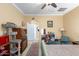 Bedroom with a ceiling fan, a cat tree, and built-in shelving at 12314 N 147Th Dr, Surprise, AZ 85379