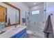 Clean bathroom with light blue vanity and a glass-enclosed shower at 12832 E Sorrel Ln, Scottsdale, AZ 85259