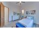 Bright bedroom with ensuite bathroom and a blue bench at 12832 E Sorrel Ln, Scottsdale, AZ 85259