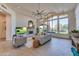 Relaxing living room with fireplace and view of backyard oasis at 12832 E Sorrel Ln, Scottsdale, AZ 85259